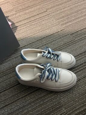 white and blue sneakers